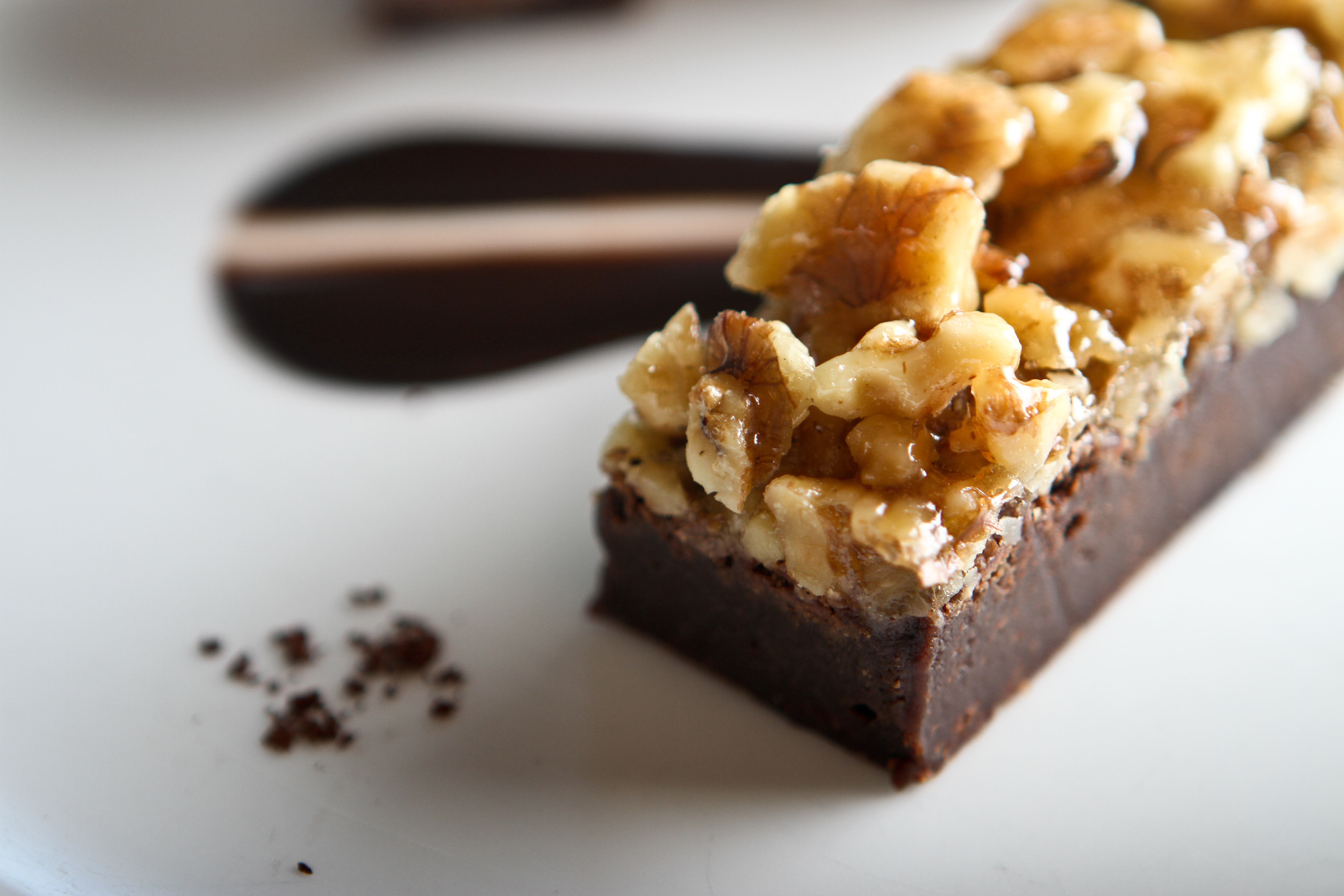 Image of chocolate brownie with nuts. 