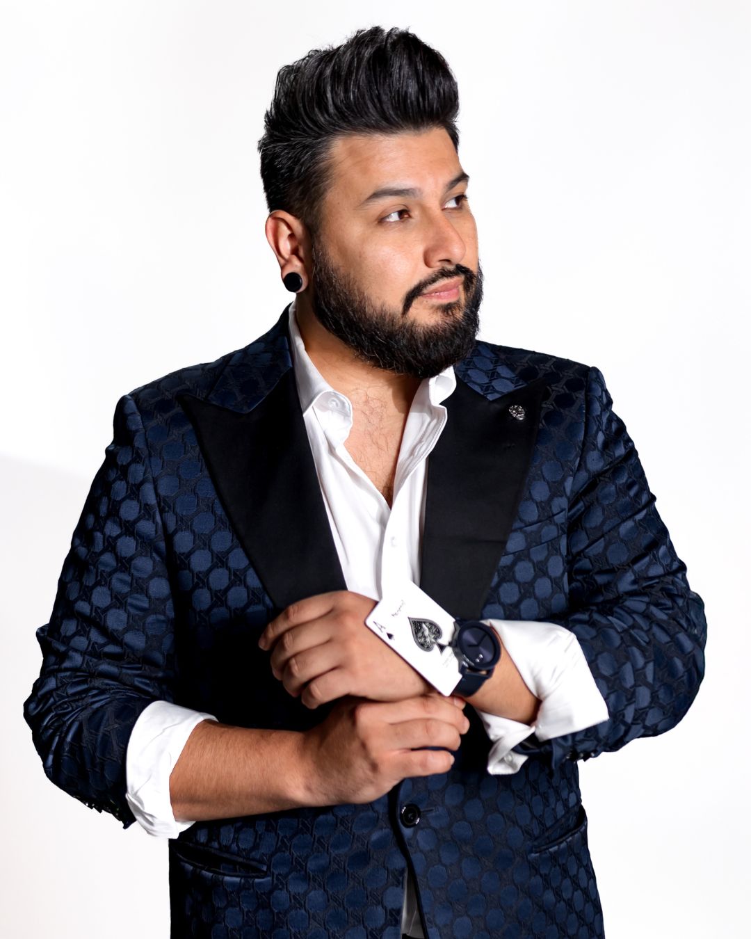 Headshot of Luis Carreon with a hidden card in his jacket.