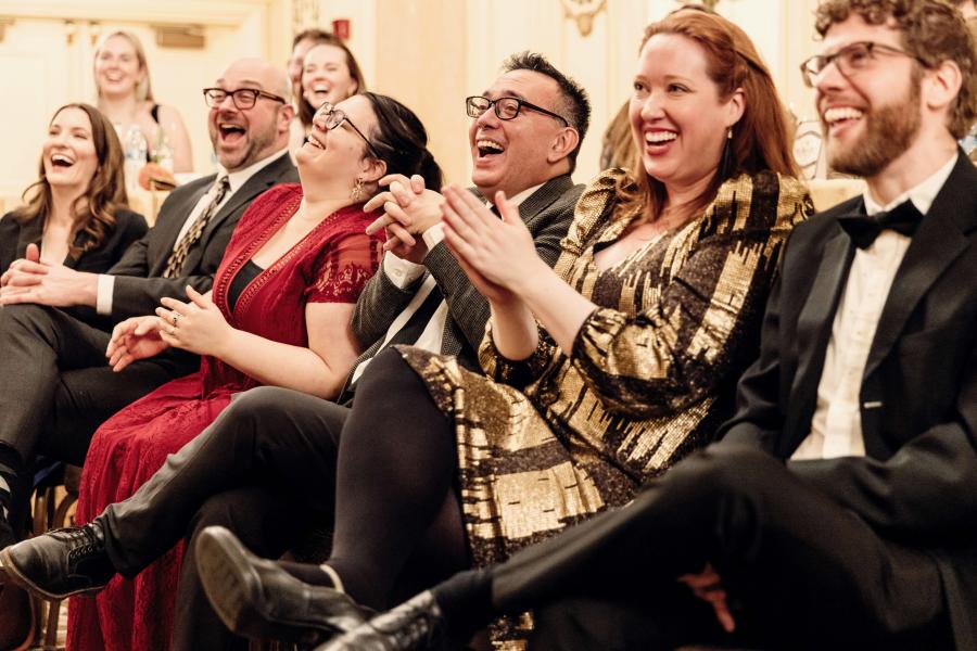 Guests smiling and laughing.