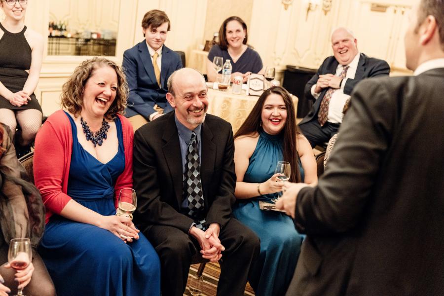 Group of people smiling and laughing.